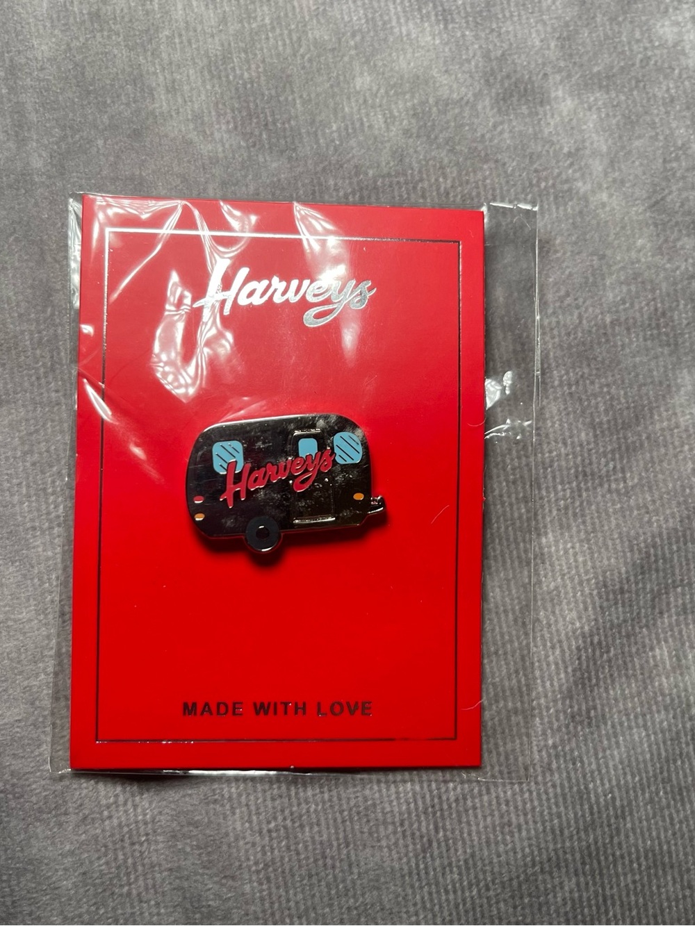 New Harvey’s seatbelt brand camper pin